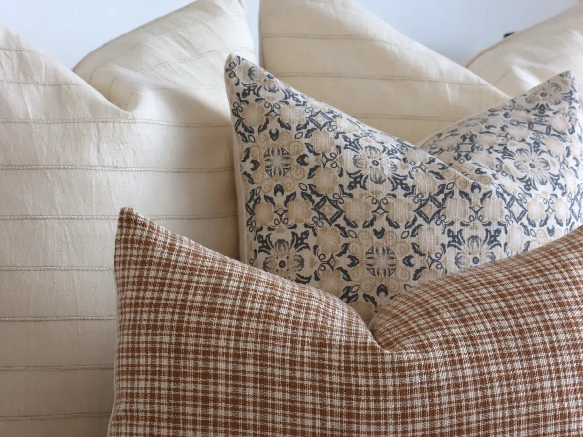 Several cushion fabric textures are shown close up including linen and cotton.