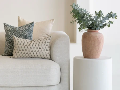 A cluster of patterned designs illustrating how many cushions on a sofa looks good.