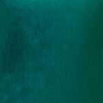 Close up photo of emerald green velvet cushion cover