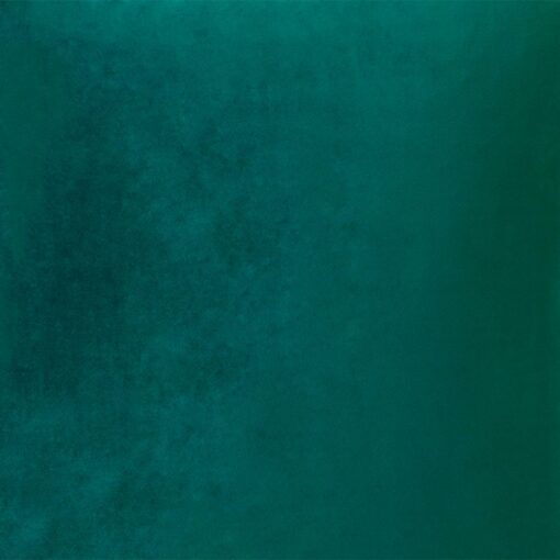 Close up photo of emerald green velvet cushion cover