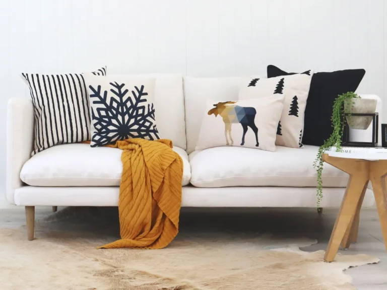 Elegant living room scene showing how to match cushions to sofa based on colour and style.