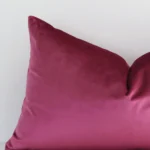 Zoomed photo of the top left corner of this blush solid-coloured cushion cover. The image clearly shows the velvet material and rectangle dimensions.