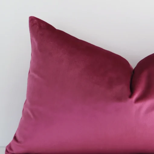 Zoomed photo of the top left corner of this blush solid-coloured cushion cover. The image clearly shows the velvet material and rectangle dimensions.