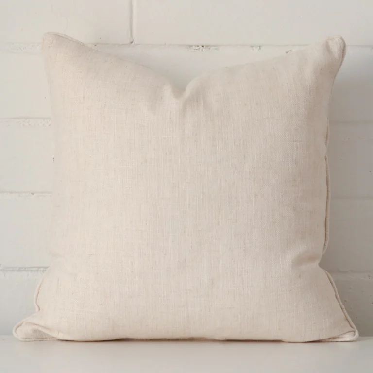 Striking square cream cushion cover made from a linen fabric.