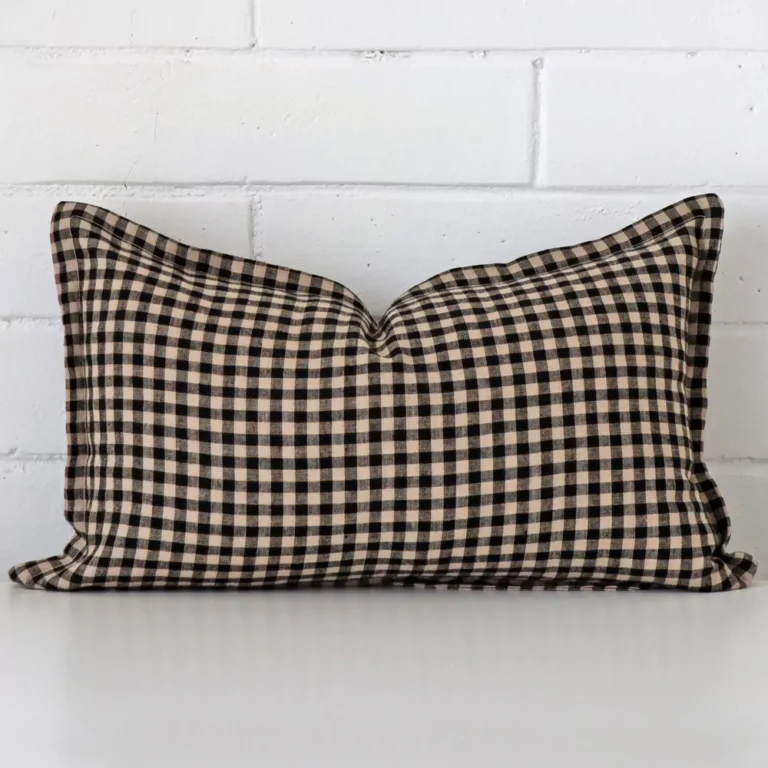 An eye-catching designer rectangle cushion cover. It has a unique gingham style.