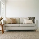 Hali cushions displayed on sofa with neutral tones and subtle geometric patterns.