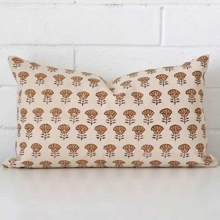 A premium designer cushion boasting a floral design and in a rectangle size.