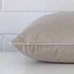 Side edge of large cushion. The velvet material and natural colour can be seen from this lateral viewpoint.