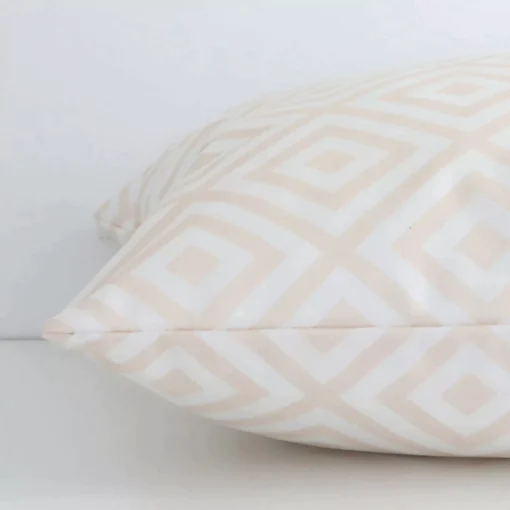 Beige geometric cushion cover laid on its back side. The image shows a side-on view of the outdoor material and its square dimensions.