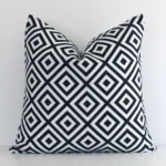 Striking square black-and-white cushion cover featuring a geometric style on quality outdoor fabric.
