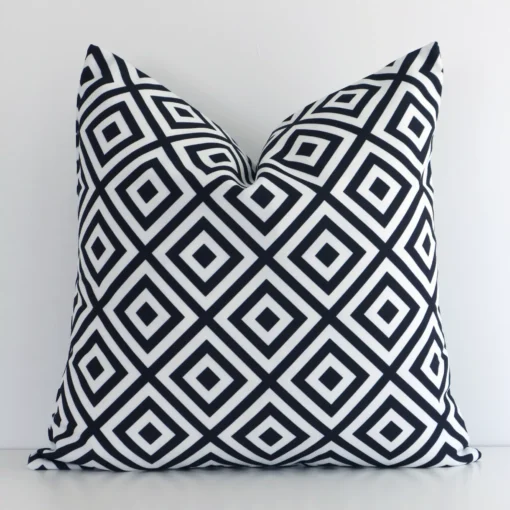 Striking square black-and-white cushion cover featuring a geometric style on quality outdoor fabric.