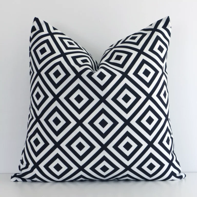 Striking square black-and-white cushion cover featuring a geometric style on quality outdoor fabric.