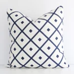 A premium outdoor navy beige cushion boasting a geometric design and in a square size.