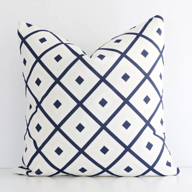 A premium outdoor navy beige cushion boasting a geometric design and in a square size.