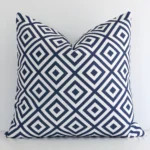 A premium outdoor navy cushion boasting a geometric design and in a square size.