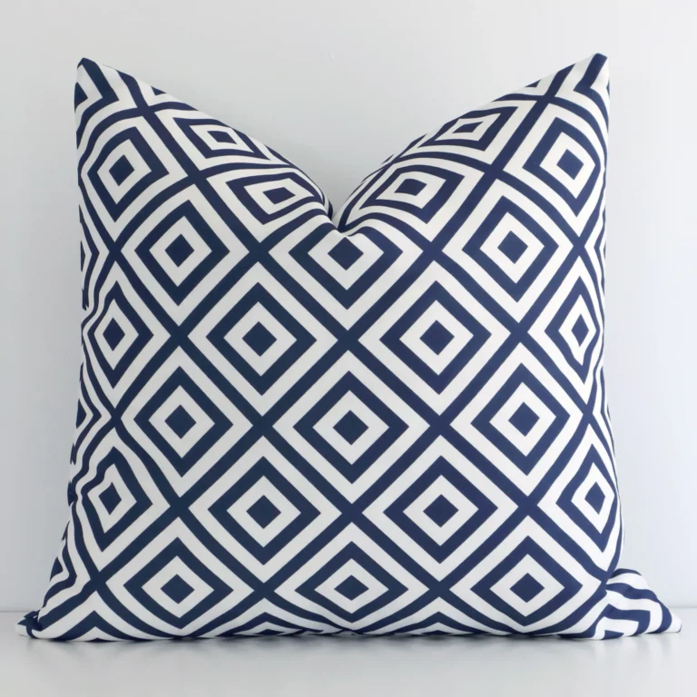 A premium outdoor navy cushion boasting a geometric design and in a square size.