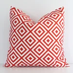 Front view of geometric square cushion. Crafted from a special outdoor material in a red colour