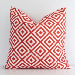 Front view of geometric square cushion. Crafted from a special outdoor material in a red colour
