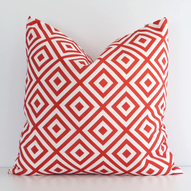 Front view of geometric square cushion. Crafted from a special outdoor material in a red colour