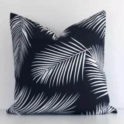 An eye-catching outdoor square cushion cover featuring a hue that is black and white. It has a unique palm design.