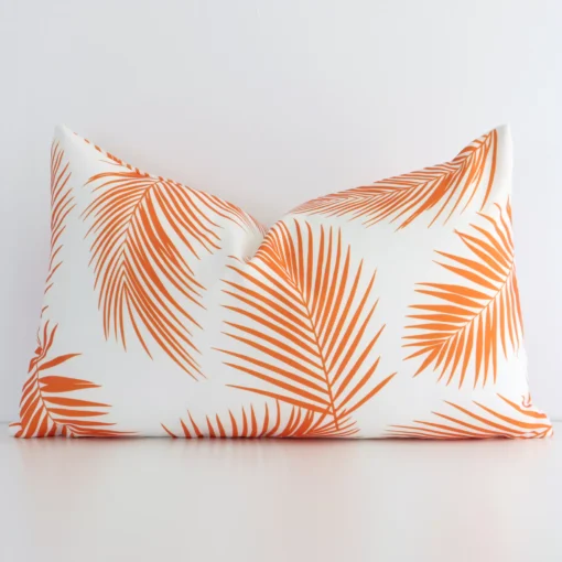 Vibrant orange palm-styled cushion cover constructed from outdoor fabric and shown in a rectangle shape.