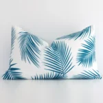 A bold palm styled outdoor cushion in a sleek rectangle size with a teal tone of colour.