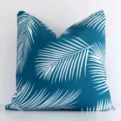 A stunning square outdoor cushion in a teal colour. It has an exquisite design.