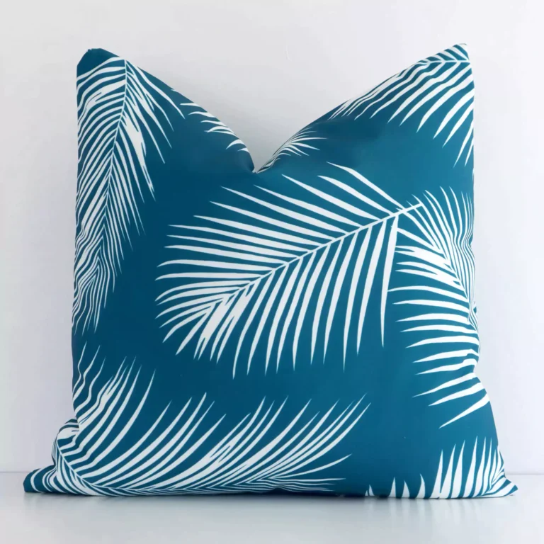 A stunning square outdoor cushion in a teal colour. It has an exquisite design.