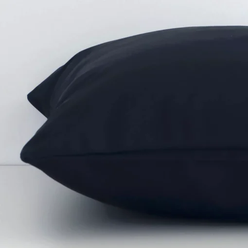 Black solid-coloured cushion cover laid on its back side. The image shows a side-on view of the outdoor material and its square dimensions.