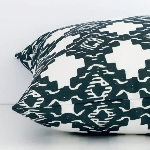 Lateral view of front and back panels of this patterned linen cushion cover in a square size. It has a green print.