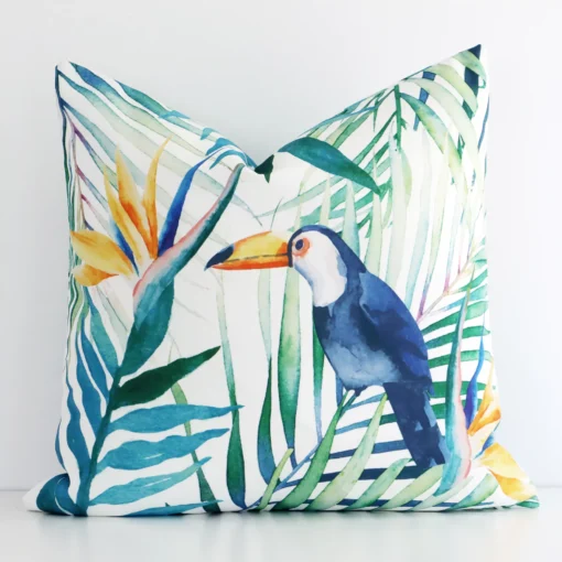 A hero shot of a tropical square cushion cover. It is made from a deluxe linen fabric and features a colourful print.