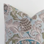 Macro image of a linen square cushion cover. The shot shows the colourful hue and patterned style more thoroughly.