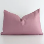 A graceful rectangle blush cushion with a solid-coloured style on durable linen fabric.
