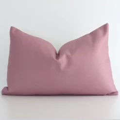 A graceful rectangle blush cushion with a solid-coloured style on durable linen fabric.