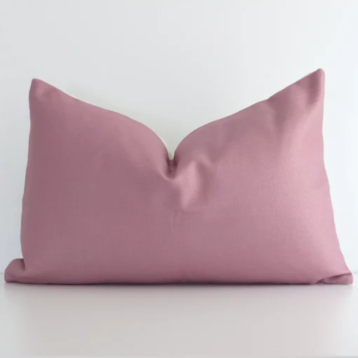 A graceful rectangle blush cushion with a solid-coloured style on durable linen fabric.