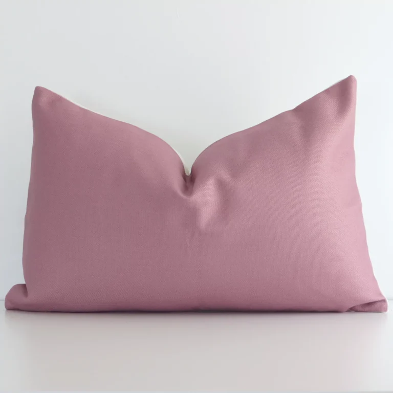 A graceful rectangle blush cushion with a solid-coloured style on durable linen fabric.