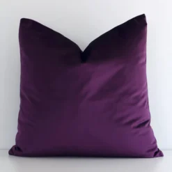 A premium velvet plum purple cushion boasting a solid colour design and in a square size.