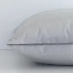 Square velvet cushion cover positioned flat to show seams. The silver hue and solid-coloured design are shown between front and rear fabric panels.
