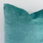 A detailed shot of this spearmint solid-coloured cushion cover that has velvet fabric and a square size.