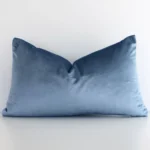 A graceful rectangle stone blue cushion with a solid colour style on durable velvet fabric.