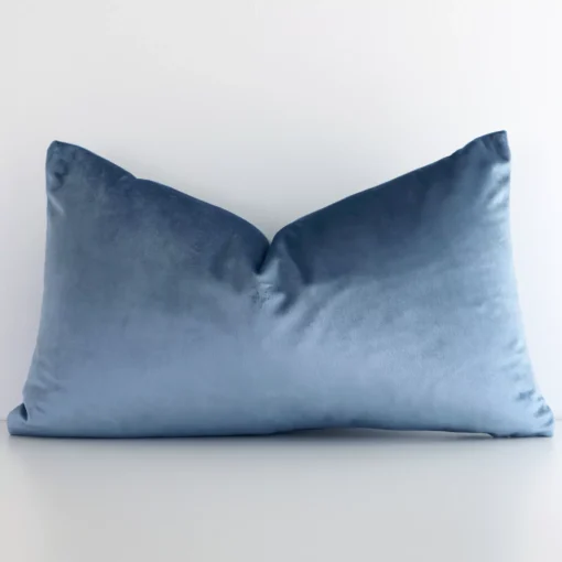 A graceful rectangle stone blue cushion with a solid colour style on durable velvet fabric.