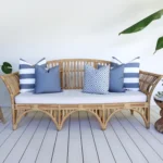 Outdoor seating with a set of 5 grey outdoor sofa cushions.