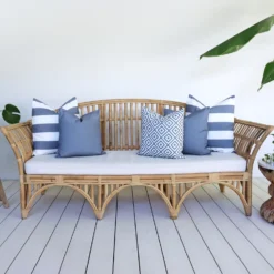 Outdoor seating with a set of 5 grey outdoor sofa cushions.