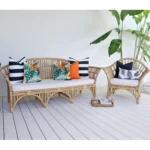 The Byron outdoor set of 7 orange sofa cushions is styled on rattan seats.