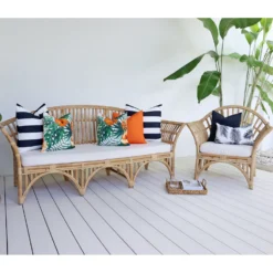 The Byron outdoor set of 7 orange sofa cushions is styled on rattan seats.