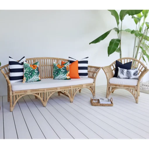 The Byron outdoor set of 7 orange sofa cushions is styled on rattan seats.