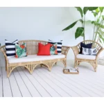 Rattan seats showcasing the set of 7 of Byron outdoor couch cushions.