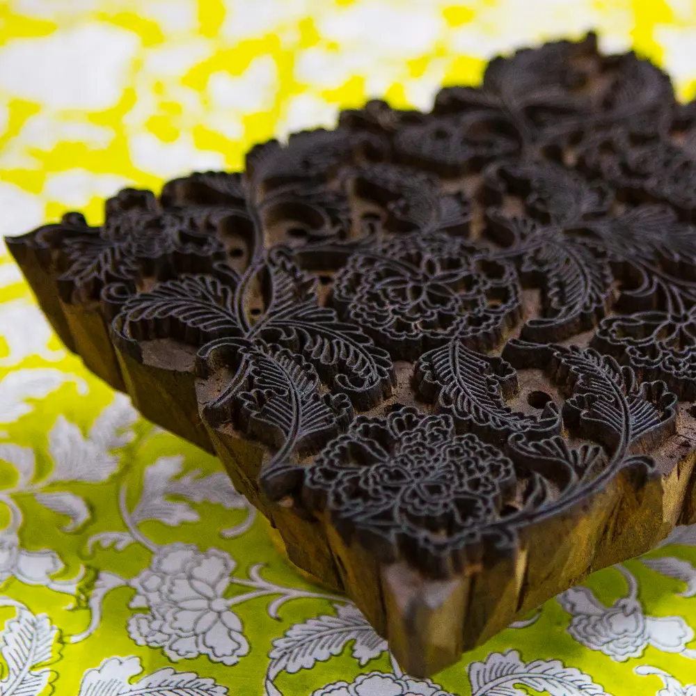 A carved wooden block used for printing on premium fabric.