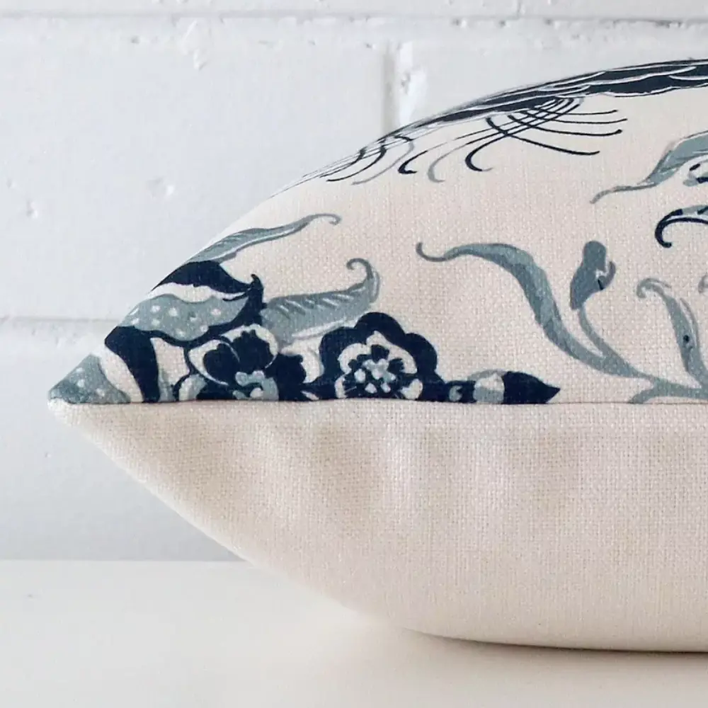 A close up showing detail of the seam and texture of a cotton linen cushion.