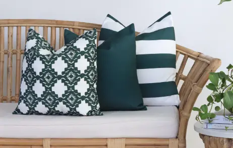 A matching outdoor cushion set sits on a timber bench.